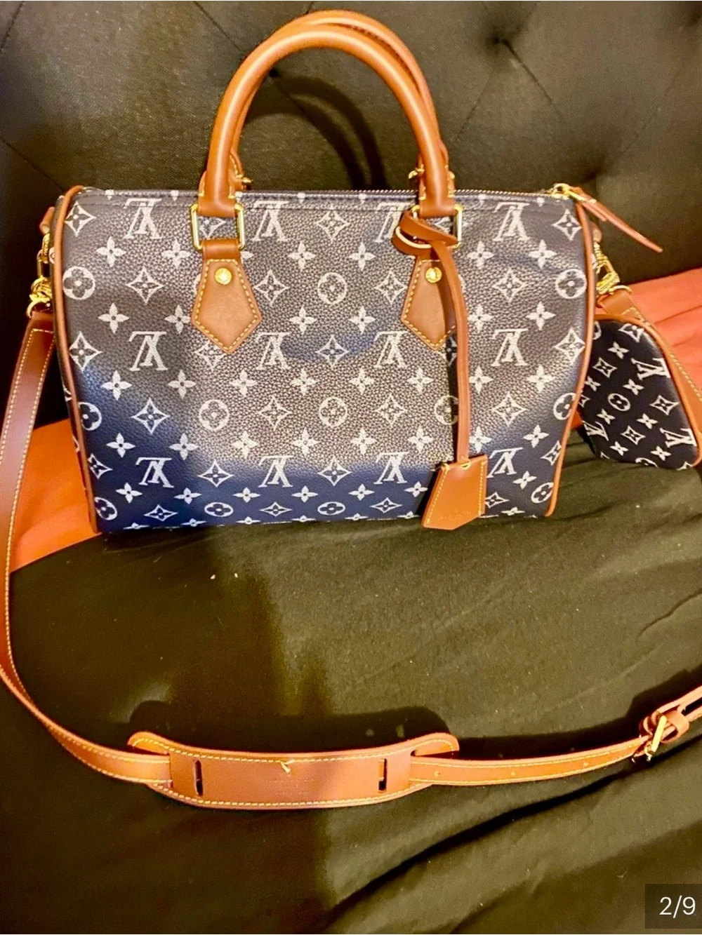 NOT AUTHENTIC Louis Vuitton Navy Monogram Satchel with Brown Leather Trim.